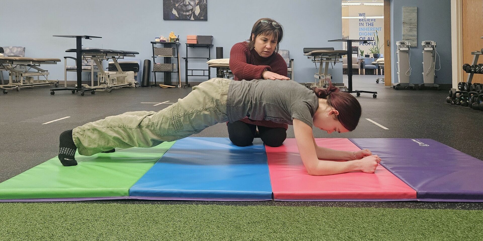 A photo of students and instructor in a PT360 exercise class