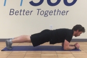 A man does a strengthening exercise in a PT360 workout room