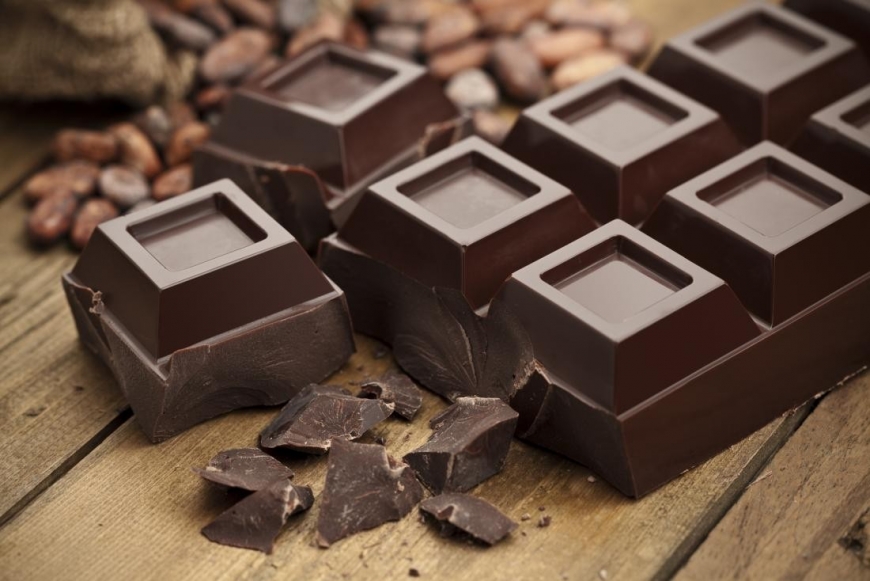 A photo of a bar of dark chocolate