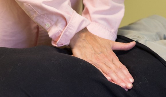 A therapist performs Manual Lymph Drainage on the abdomen of a patient with Lymphedema.